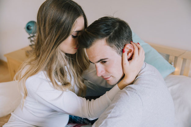 A woman touching a guy